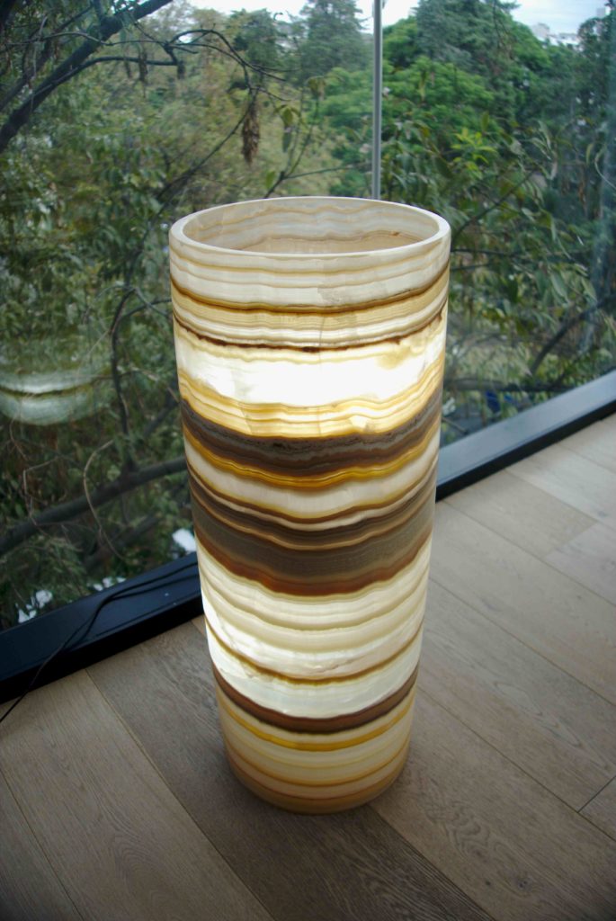 Cylindrical Floor Lamp from Onyx Ambar Collection next to the glass wall. Height - 70 cm. Diameter - 25 cm.