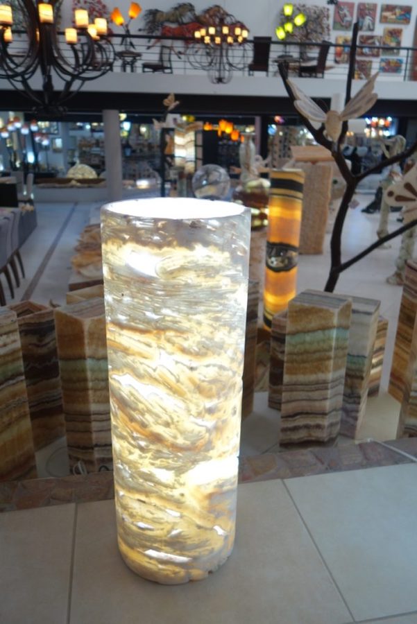 Gray, Yellow, and Orange Onyx Picado Table Lamp with Light On.