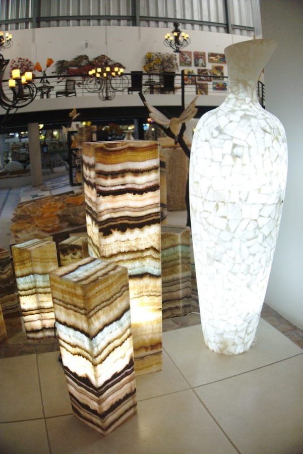 Two Serpentina Beta Azul Rectangular Floor Lamps of different heights standing next to white floor onyx vase made using marqueteria technique